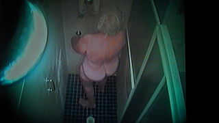 Gran playing with her pussy in the shower.